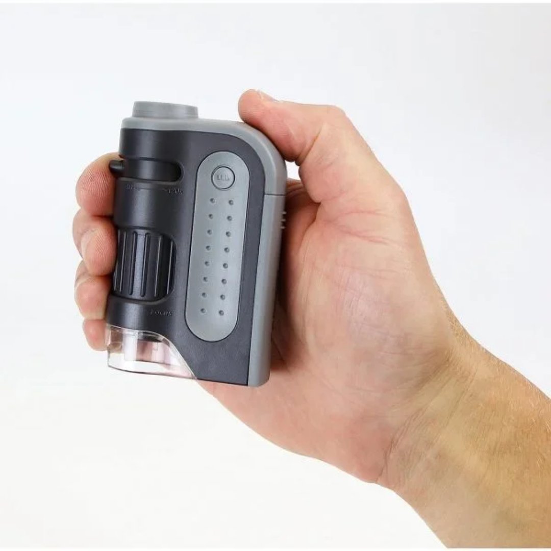 Lupa microscopio portátil con aumento de 60x y 120x, iluminación LED y diseño compacto para observar detalles de muestras y objetos pequeños.